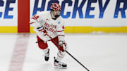 Mar 29, 2025; Toledo, OH, USA; Boston University defenseman Cole Hutson (44) skates with the puck in the third period against the Cornell at Huntington Center. Mandatory Credit: Rick Osentoski-Imagn Images