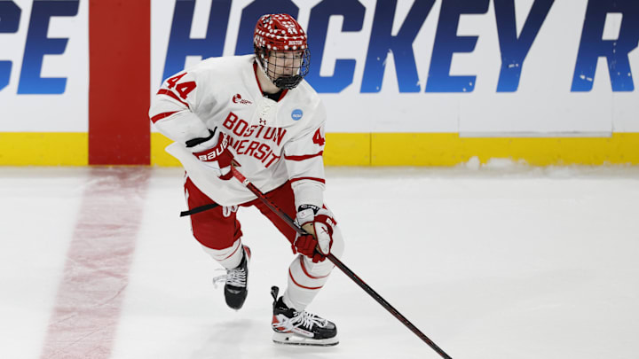 Mar 29, 2025; Toledo, OH, USA; Boston University defenseman Cole Hutson (44) skates with the puck in the third period against the Cornell at Huntington Center. Mandatory Credit: Rick Osentoski-Imagn Images