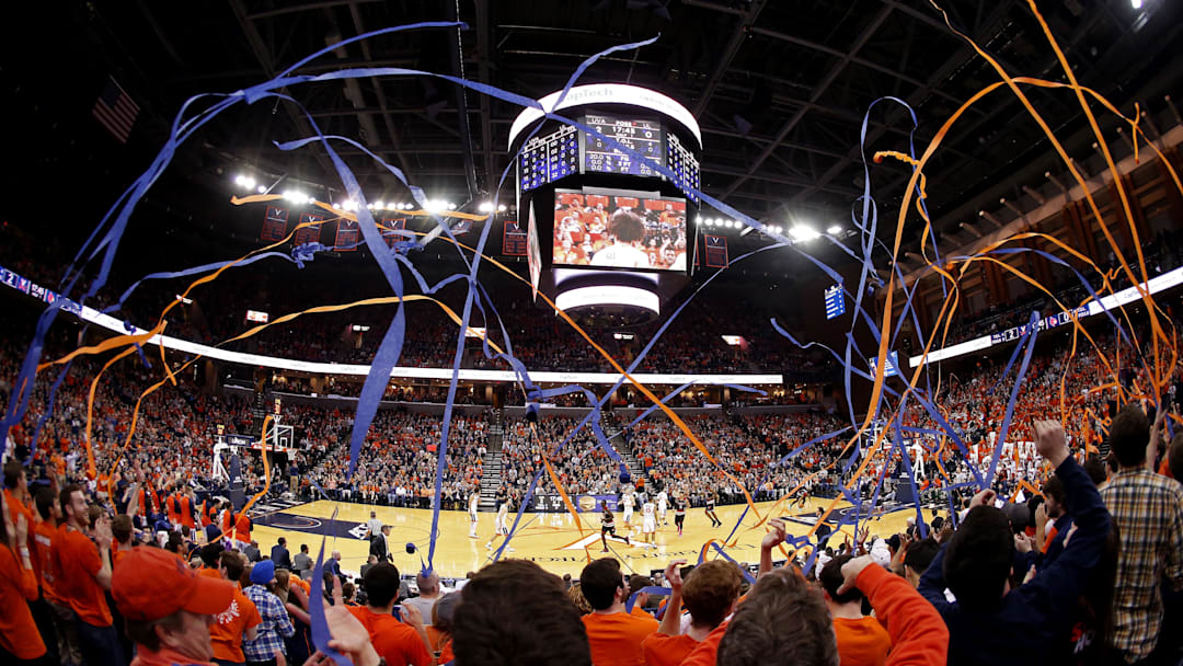 Mar 5, 2016; Charlottesville, VA, USA; Virginia Cavaliers fans throw streamers after the Cavaliers' first basket against the Louisville Cardinals in the first half at John Paul Jones Arena. Mandatory Credit: Geoff Burke-Imagn Images