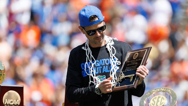 Apr 12, 2025; Gainesville, FL, USA; Florida Gators head coach Todd Golden holds the City of Gainesville Key to the City during the National Championship celebration at Ben Hill Griffin Stadium. Mandatory Credit: Matt Pendleton-Imagn Images
