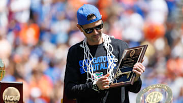 Apr 12, 2025; Gainesville, FL, USA; Florida Gators head coach Todd Golden holds the City of Gainesville Key to the City during the National Championship celebration at Ben Hill Griffin Stadium. Mandatory Credit: Matt Pendleton-Imagn Images