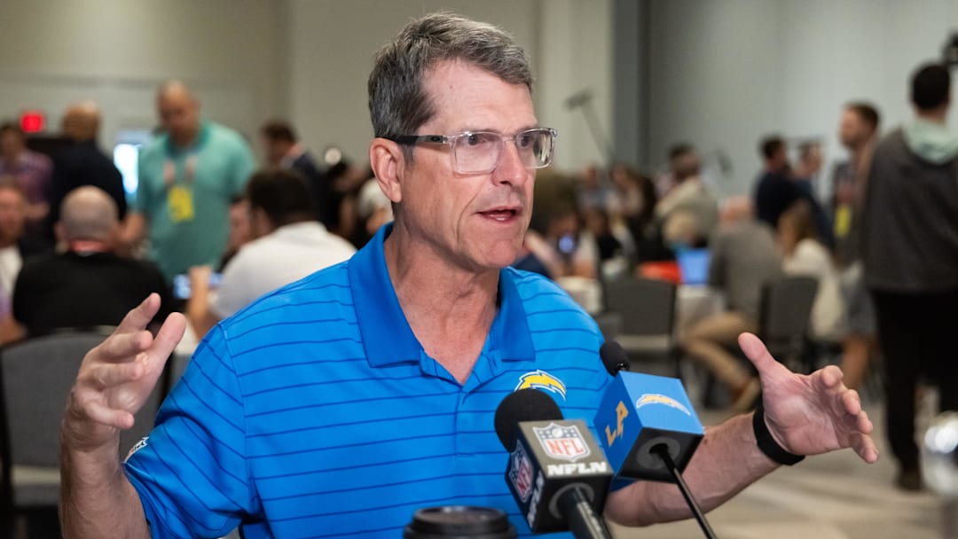 Mar 31, 2026; Phoenix, AZ, USA; Los Angeles Chargers head coach Jim Harbaugh speaks to reporters in the media during the 2026 NFL Annual League Meeting at the Arizona Biltmore. Mandatory Credit: Mark J. Rebilas-Imagn Images