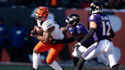 Baltimore Ravens inside linebacker Roquan Smith (0) tackles Cincinnati Bengals running back Samaje Perine (34) in the first quarter of the NFL football game at Paycor Stadium in Cincinnati on Dec. 14, 2025.