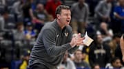 Mar 12, 2025; Nashville, TN, USA;  Vanderbilt Commodores head coach Mark Byington cheers on his team against the Texas Longhorns during the second half at Bridgestone Arena. Mandatory Credit: Steve Roberts-Imagn Images