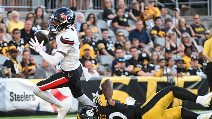 Aug 9, 2024; Pittsburgh, Pennsylvania, USA;  Houston Texans wide receiver Tank Dell (3) eludes Pittsburgh Steelers linebacker Elandon Roberts (50) to score a touchdown during the first quarter at Acrisure Stadium. Mandatory Credit: Barry Reeger-USA TODAY Sports