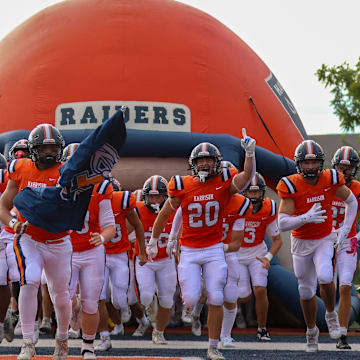 The Harrison Raiders take the field Friday, August 22, 2025, before the IHSAA football game against the West Lafayette Red Devils at Harrison High School in West Lafayette, Indiana.