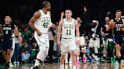 Apr 20, 2025; Boston, Massachusetts, USA; Boston Celtics guard Payton Pritchard (11) reacts towards center Al Horford (42) after making a three point basket during the first half against the Orlando Magic at TD Garden. Mandatory Credit: Bob DeChiara-Imagn Images