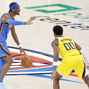 Jun 22, 2025; Oklahoma City, Oklahoma, USA; Oklahoma City Thunder guard Shai Gilgeous-Alexander (2) dribbles the ball against Indiana Pacers guard Bennedict Mathurin (00) during the second half of game seven of the 2025 NBA Finals at Paycom Center. Mandatory Credit: Alonzo Adams-Imagn Images