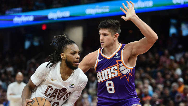 Mar 11, 2024; Cleveland, Ohio, USA; Cleveland Cavaliers guard Darius Garland (10) drives to the basket against Phoenix Suns guard Grayson Allen (8) during the second half at Rocket Mortgage FieldHouse. Mandatory Credit: Ken Blaze-USA TODAY Sports