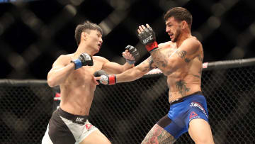 Dec 10, 2016; Toronto, ON, CAN; Cub Swanson (red gloves) fights Dooho Choi (blue gloves) during UFC 206 at Air Canada Centre. Mandatory Credit: Tom Szczerbowski-USA TODAY Sports