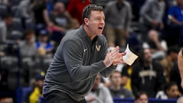 Vanderbilt Commodores head coach Mark Byington cheers on his team against the Texas Longhorns during the second half at Bridgestone Arena.
