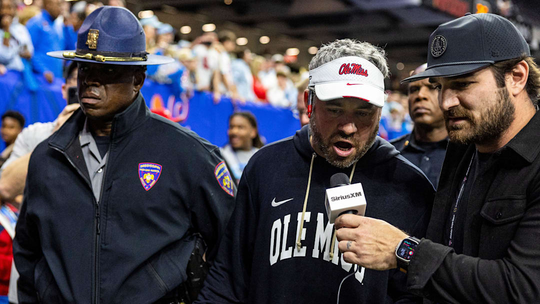 Ole Miss head coach Pete Golding completes an interview while heading to the locker room after the Sugar Bowl and College Football Playoff quarterfinals at Caesars Superdome in New Orleans, La., on Thursday, Jan. 1, 2026. Ole Miss defeated Georgia 39-34.