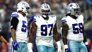 Aug 12, 2023; Arlington, Texas, USA;Dallas Cowboys defensive tackle Osa Odighizuwa (97) and defensive tackle Mazi Smith (58) on the field in the game against the Jacksonville Jaguars  at AT&T Stadium.