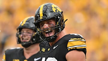 Sep 14, 2024; Iowa City, Iowa, USA; Iowa Hawkeyes defensive lineman Max Llewellyn (48) reacts after a sack during the third quarter against the Troy Trojans at Kinnick Stadium. Mandatory Credit: Jeffrey Becker-Imagn Images