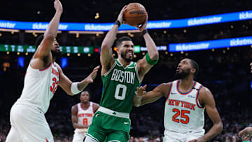  New York Knicks forward Mikal Bridges (25) and center Karl-Anthony Towns (32) defend against Boston Celtics forward Jayson Tatum (0) at TD Garden.