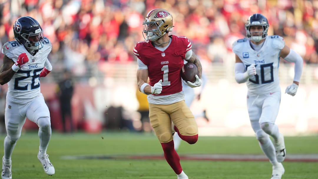 Dec 14, 2025; Santa Clara, California, USA;  San Francisco 49ers wide receiver Ricky Pearsall (1) runs with the ball during the third quarter against Tennessee Titans cornerback Marcus Harris (26) and linebacker Cody Barton (50)  at Levi's Stadium. Mandatory Credit: Cary Edmondson-Imagn Images