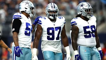 Dallas Cowboys defensive tackle Osa Odighizuwa (97) and defensive tackle Mazi Smith (58) on the field in the game against the Jacksonville Jaguars at AT&T Stadium.