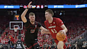 Mar 8, 2025; Louisville, Kentucky, USA;  Louisville Cardinals forward Noah Waterman (93) dribbles against Stanford Cardinal forward Aidan Cammann (52) during the second half at KFC Yum! Center. Louisville defeated Stanford 68-48. Mandatory Credit: Jamie Rhodes-Imagn Images