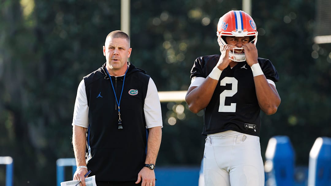 Florida Gators head coach Billy Napier and Florida Gators quarterback DJ Lagway (2) watch during spring football practice at Heavener Football Complex at the University of Florida in Gainesville, FL on Thursday, March 6, 2025. [Matt Pendleton/Gainesville Sun]