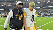 Pittsburgh Steelers head coach Mike Tomlin and quarterback Aaron Rodgers (8) walk off the field after the game against the Los Angeles Chargers at SoFi Stadium. 