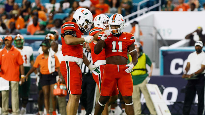 Sep 7, 2024; Miami Gardens, Florida, USA; Miami Hurricanes defensive lineman Elijah Alston (11) celebrates after sacking Florida A&M Rattlers quarterback Daniel Richardson (not pictured) during the third quarter at Hard Rock Stadium. Mandatory Credit: Sam Navarro-Imagn Images