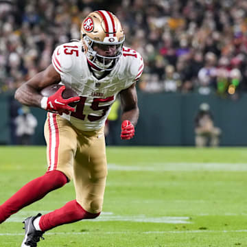 Nov 24, 2024; Green Bay, Wisconsin, USA;  San Francisco 49ers wide receiver Jauan Jennings (15) rushes with the football after catching a pass during the second quarter against the Green Bay Packers at Lambeau Field. Mandatory Credit: Jeff Hanisch-Imagn Images