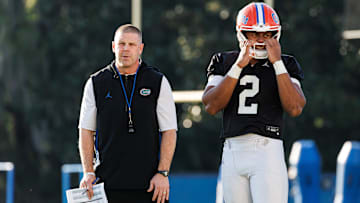 Florida Gators head coach Billy Napier and Florida Gators quarterback DJ Lagway (2) watch during spring football practice at Heavener Football Complex at the University of Florida in Gainesville, FL on Thursday, March 6, 2025. [Matt Pendleton/Gainesville Sun]