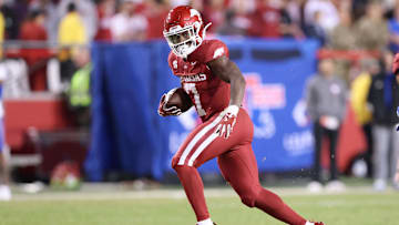 Nov 23, 2024; Fayetteville, Arkansas, USA; Arkansas Razorbacks running back Rashod Dubinion (7) runs during the fourth quarter against the Louisiana Tech Bulldogs at Donald W. Reynolds Razorback Stadium. Arkansas won 35-14. Mandatory Credit: Nelson Chenault-Imagn Images