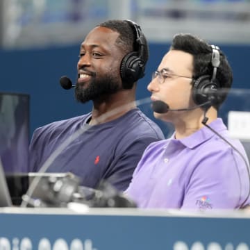 Jul 27, 2024; Villeneuve-d'Ascq, France; Dwyane Wade looks on from the media bench during the first half between Canada and Greece during the Paris 2024 Olympic Summer Games at Stade Pierre-Mauroy. Mandatory Credit: John David Mercer-USA TODAY Sports