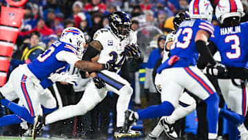 Baltimore Ravens running back Derrick Henry runs the ball against the Buffalo Bills in a 2025 AFC divisional round game