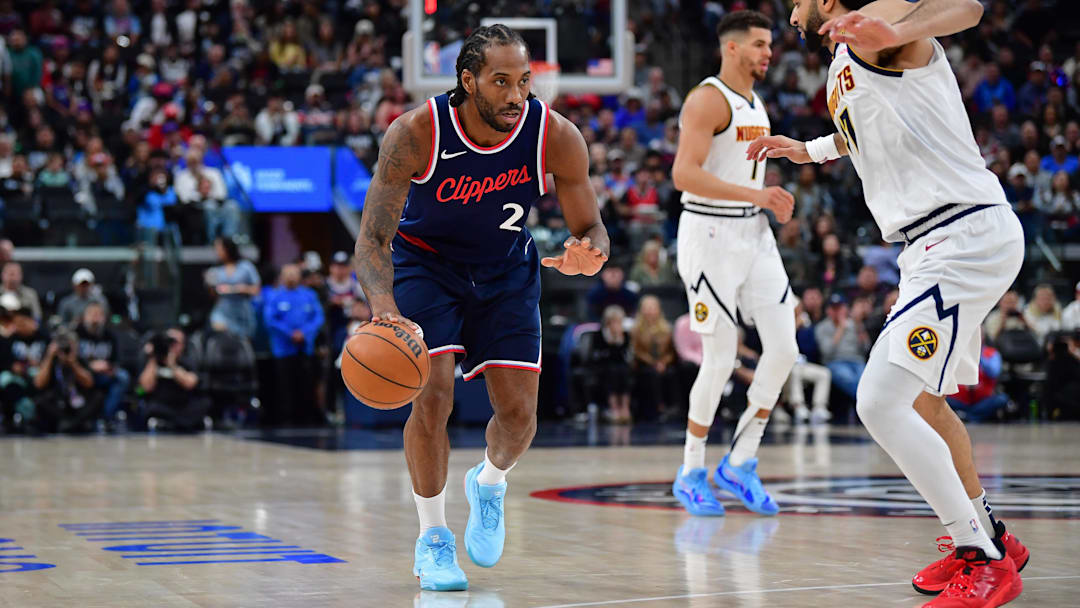 Los Angeles Clippers forward Kawhi Leonard (2) moves the ball against Denver Nuggets guard Jamal Murray (27) Los Angeles Clippers forward Kawhi Leonard (2) moves the ball against Denver Nuggets guard Jamal Murray (27)