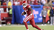 Nov 23, 2024; Fayetteville, Arkansas, USA; Arkansas Razorbacks running back Rashod Dubinion (7) runs during the fourth quarter against the Louisiana Tech Bulldogs at Donald W. Reynolds Razorback Stadium. Arkansas won 35-14. Mandatory Credit: Nelson Chenault-Imagn Images