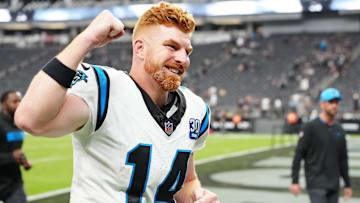 Sep 22, 2024; Paradise, Nevada, USA; Carolina Panthers quarterback Andy Dalton (14) celebrates after the Panthers defeated the Las Vegas Raiders at Allegiant Stadium. Mandatory Credit: Stephen R. Sylvanie-Imagn Images