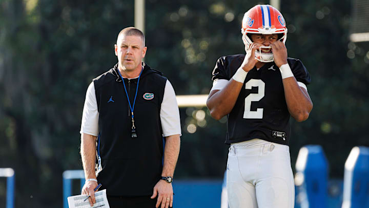 Florida Gators head coach Billy Napier and Florida Gators quarterback DJ Lagway (2) watch during spring football practice at Heavener Football Complex at the University of Florida in Gainesville, FL on Thursday, March 6, 2025. [Matt Pendleton/Gainesville Sun]