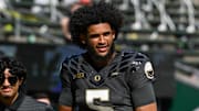 Oregon Ducks quarterback Dante Moore warms up before the game against the Oregon State Beavers at Autzen Stadium.