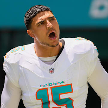 Miami Dolphins linebacker Jaelan Phillips (15) runs onto the field before the game against the Jacksonville Jaguars at Hard Rock Stadium in the 2024 season opener.