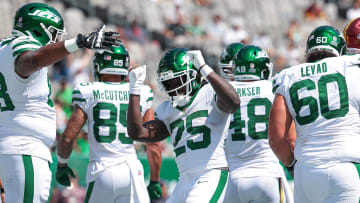 Aug 10, 2024; East Rutherford, New Jersey, USA; New York Jets running back Israel Abanikanda (25) celebrates his touchdown with teammates during the fourth quarter against the Washington Commanders at MetLife Stadium.