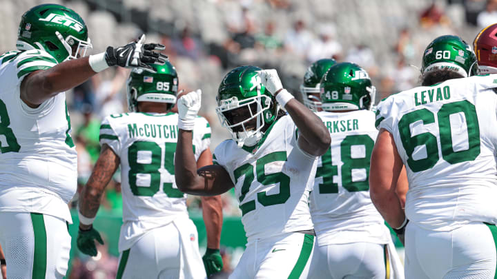 Aug 10, 2024; East Rutherford, New Jersey, USA; New York Jets running back Israel Abanikanda (25) celebrates his touchdown with teammates during the fourth quarter against the Washington Commanders at MetLife Stadium.