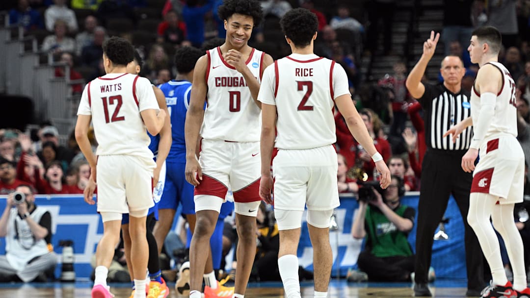 Mar 21, 2024; Omaha, NE, USA; Washington State Cougars forward Jaylen Wells (0) and guard Myles Rice (2) react in the second half against the Drake Bulldogs in the first round of the 2024 NCAA Tournament at CHI Health Center Omaha. Mandatory Credit: Steven Branscombe-USA TODAY Sports