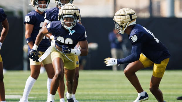 Notre Dame's Christian Gray and Leonard Moore participate in a drill at the first team practice of fall camp 2024.