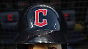 Oct 15, 2022; Cleveland, Ohio, USA; A Cleveland Guardians helmet and glove before game three of the NLDS for the 2022 MLB Playoffs at Progressive Field. Mandatory Credit: Ken Blaze-Imagn Images