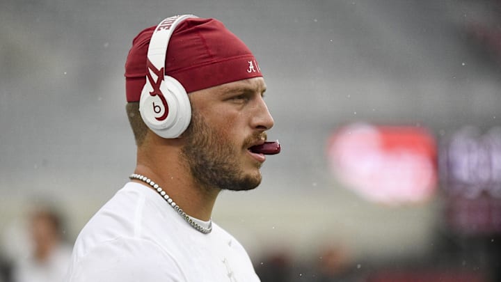 Aug 31, 2024; Tuscaloosa, Alabama, USA;  Alabama Crimson Tide tight end CJ Dippre (81) chews on a mouthpiece as he catches passes for quarterbacks warming up in Bryant-Denny Stadium prior to a game against the Western Kentucky Hilltoppers. Mandatory Credit: Gary Cosby Jr.-Imagn Images