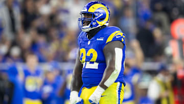 Jan 13, 2025; Glendale, AZ, USA; Los Angeles Rams defensive tackle Neville Gallimore (92) celebrates a play against the Minnesota Vikings during an NFC wild card game at State Farm Stadium. Mandatory Credit: Mark J. Rebilas-Imagn Images