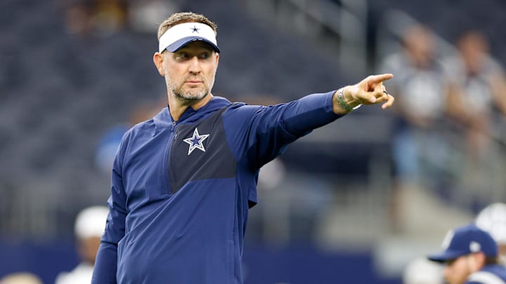 Aug 22, 2025; Arlington, Texas, USA; Dallas Cowboys head coach Brian Schottenheimer gives directions prior to the game against the Atlanta Falcons at AT&T Stadium. Mandatory Credit: Andrew Dieb-Imagn Images