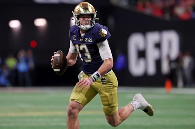 Notre Dame Fighting Irish quarterback Riley Leonard (13) looks to pass the ball against the Ohio State Buckeyes.
