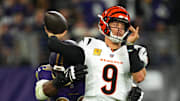Nov 7, 2024; Baltimore, Maryland, USA; Cincinnati Bengals quarterback Joe Burrow (9) is pressured by Baltimore Ravens linebacker Odafe Oweh (99) during the first quarter at M&T Bank Stadium. Mandatory Credit: Mitch Stringer-Imagn Images