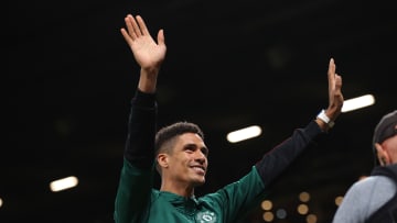 Raphael Varane greeting the fans at Old Trafford.