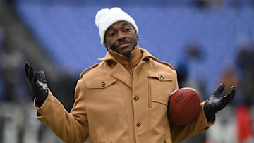 Jan 20, 2024; Baltimore, MD, USA; ESPN college football and NFL analyst Robert Griffin III reacts on the sidelines before a 2024 AFC divisional round game between the Houston Texans and the Baltimore Ravens at M&T Bank Stadium. Mandatory Credit: Tommy Gilligan-Imagn Images