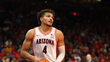 Dec 14, 2024; Phoenix, Arizona, USA; Arizona Wildcats forward Trey Townsend (4) against the UCLA Bruins at Footprint Center. Mandatory Credit: Mark J. Rebilas-Imagn Images

