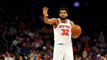 Nov 20, 2024; Phoenix, Arizona, USA; New York Knicks center Karl-Anthony Towns (32) handles the ball during the fourth quarter against the Phoenix Suns at Footprint Center. Mandatory Credit: Mark J. Rebilas-Imagn Images